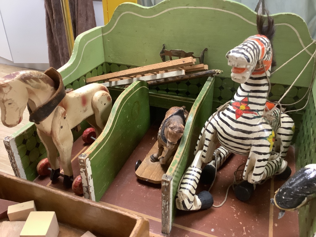 A collection of antique toys, to include a collection of puppets and a toy proscenium theatre